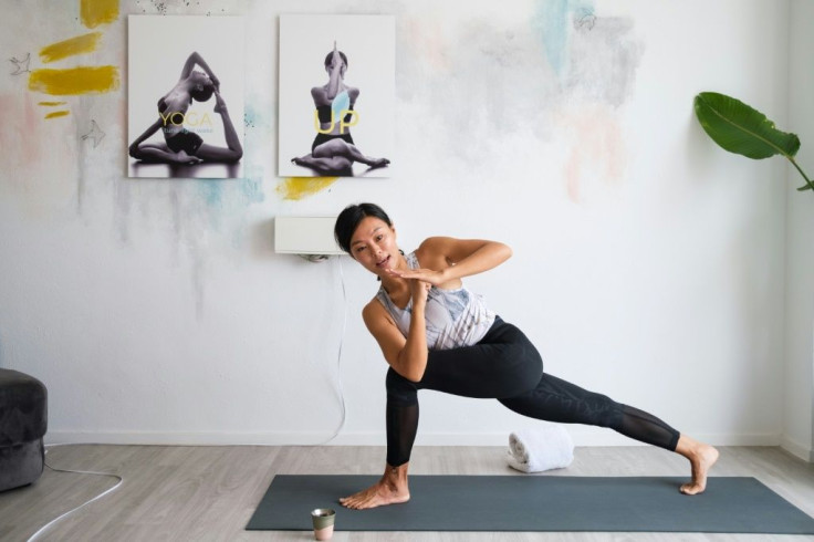 Yoga instructor Chaukei Ngai, who streams her classes, says self-isolation doesn't have to mean the end of coming together in groups
