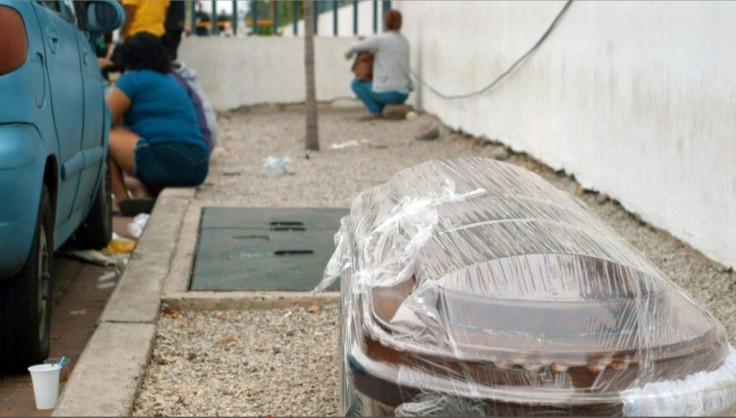 A coffin wrapped in plastic is seen outside a hospital in Guayaquil on April 1