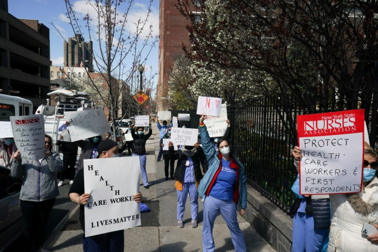 Members of the medical staff listen as Montefiore Medical Center nurses call for N95 masks and other âcriticalâ PPE to handle the coronavirus (COVID-19) pandemic on April 1, 2020 in New York