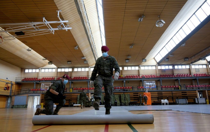 Spanish soldiers are setting up temporary shelters for homeless people in a country where more than 10,000 people have now died