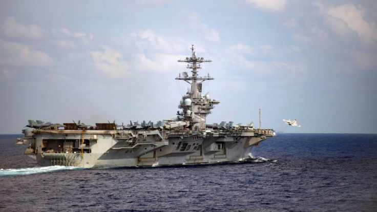 In this file US Navy handout photo an F/A-18F Super Hornet takes off from the aircraft carrier USS Theodore Roosevelt on March 18, 2020 in the Pacific Ocean