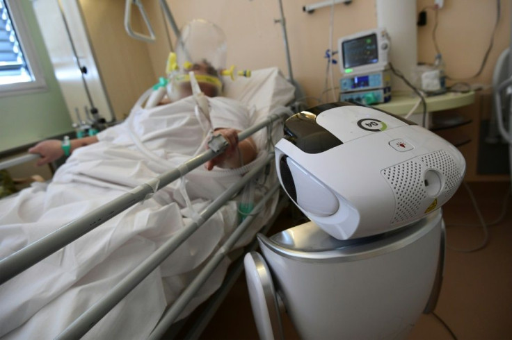 One of the six robots at the Circolo di Varese hospital in northern Italy checks up on a patient in the intensive care unit, helping medical staff reduce the risk of direct contact