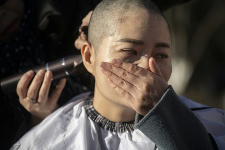 Li Wenzu shaved her head in 2018 in protest at the jailing of her husband Wang Quanzhang during the 709 crackdown