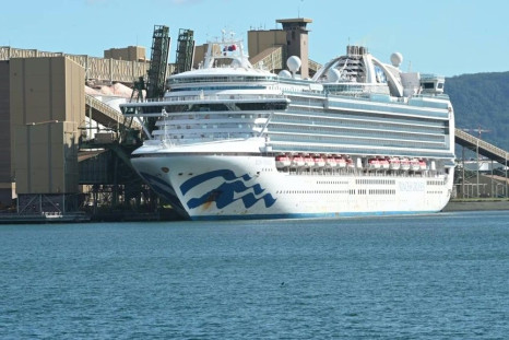 The Ruby Princess cruise ship sits docked at Port Kembla south of Sydney where it is expected to remain for several days after hundreds of crew showed symptoms of coronavirus. The local government hopes the days of quarantine and restocking at the port wi