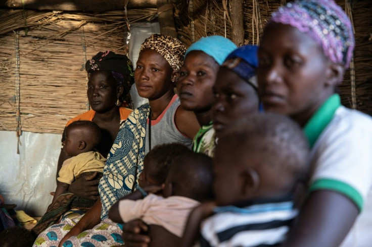 Displaced women and children in Kaya, northern Burkina Faso. Overcrowding in the camps makes social distancing a huge challenge, say aid workers