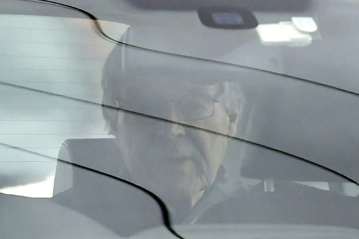 Cardinal George Pell is driven from prison after being released