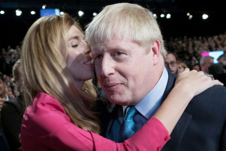 Johnson with his partner Carrie Symonds, who is pregnant with their first child together