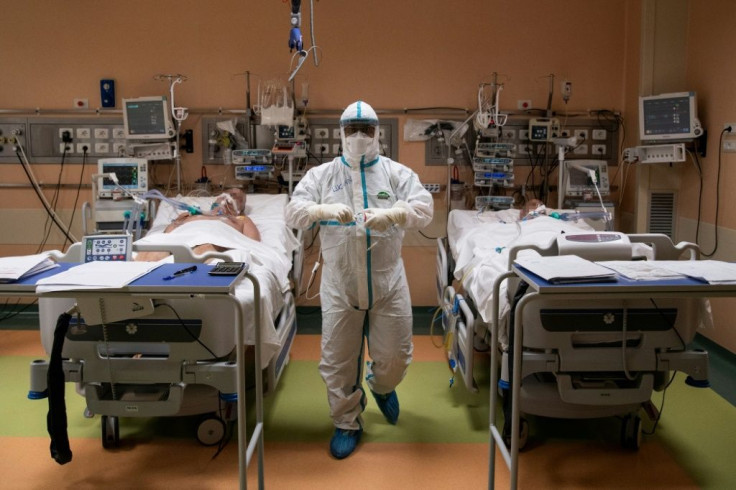 A doctor in full protective gear in the intensive care unit of a Turin hospital on Tuesday.