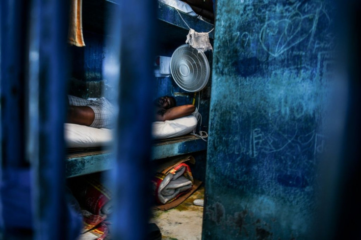 A prisoner rests in a cell in Haiti's National Penitentiary in Port-au-Prince, Haiti on August 30, 2019