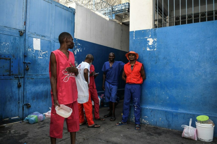 Prison inmates wait for food inside Haiti's National Penitentiary in Port-au-Prince, Haiti, on August 30, 2019