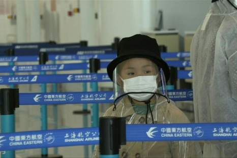 IMAGESPassengers arrive and check in for flights at Wuhan Tianhe Airport as China lifts a travel ban on residents of the central city, where the coronavirus pandemic began last year.