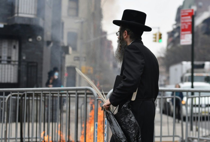 The scent of the traditional burning of chametz -- leavened products forbidden during the observant period -- wafted through the Hasidic zone of Crown Heights, the morning before Passover commenced