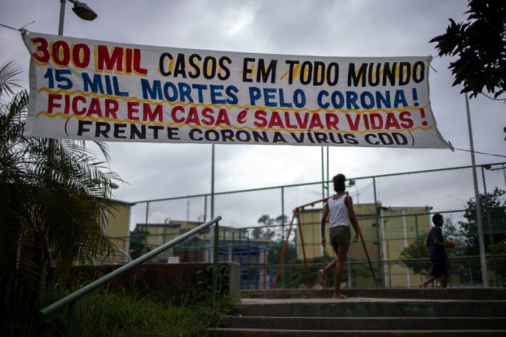 "Stay home and save lives" says this sign in City of God -- a hush reigns over the usually jam-packed streets of Rio de Janeiro