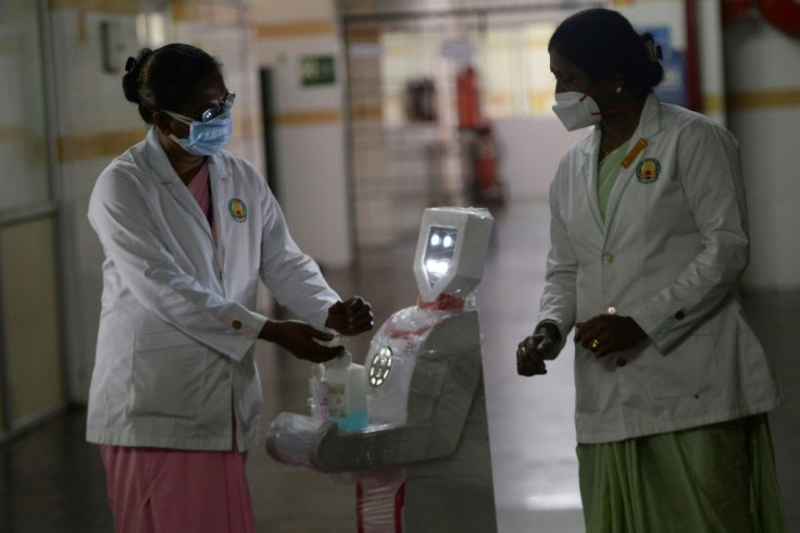 Stanley Medical hospital staff in Chennai participate in a demo of the interactive robot "Zafi", which will be deployed at Covid-19 isolation wards in the Indian city