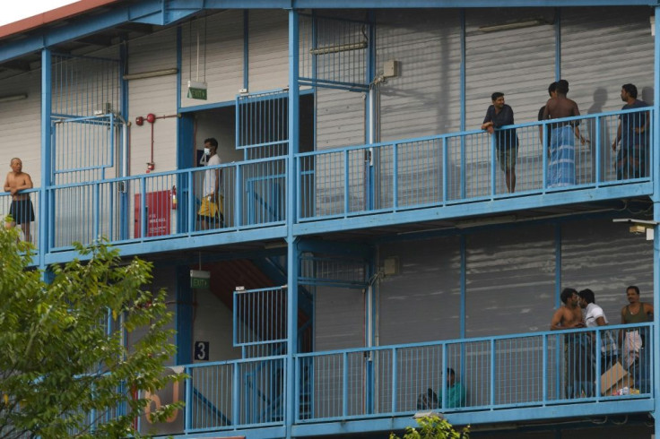 Singapore has quarantined four large dormitory complexes housing tens of thousands of mostly South Asian workers, where more than 200 cases have so far been detected