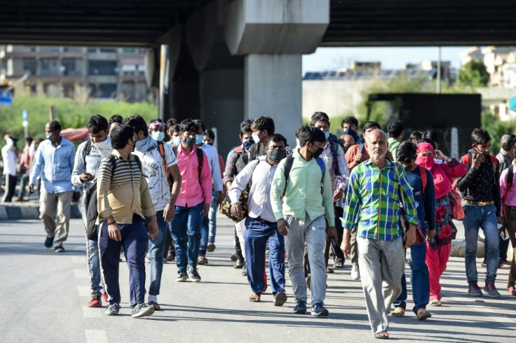 Fearing hunger and lockdowns, hundreds of thousands of migrant workers and their families went back to their villages in India last month
