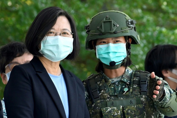 Taiwan President Tsai Ing-wen listens to a soldier during a visit to a military base in Tainan