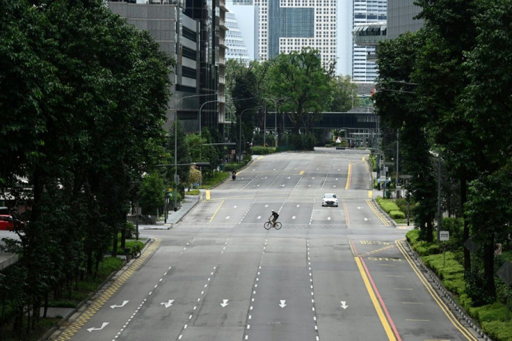 Infections in Singapore are rising sharply and authorities this week introduced tough new curbs, including closing most workplaces and asking people to stay at home