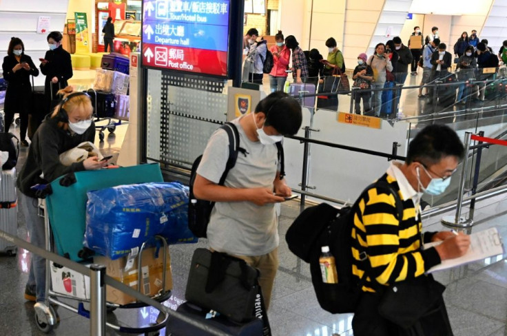 Passengers waiting for government-assigned taxis in March 2020 at Taoyuan Airport in Taiwan, which has required everyone arriving into the country to self-quarantine for two weeks as a preventive measure against the spread of the new coronavirus