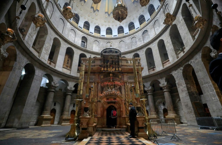 Visitors walk past the Edicule in the Church of the Holy Sepulchre last month, before the place of worship was closed to forestall the spread of coronavirus
