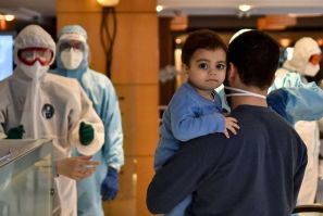 Lebanese nationals repatriated from Qatar enter quarantine at a hotel in the Lebanese capital Beirut