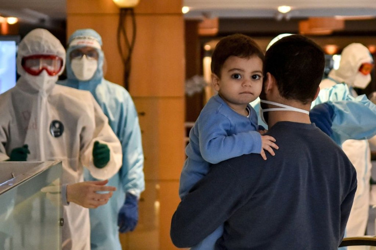Lebanese nationals repatriated from Qatar enter quarantine at a hotel in the Lebanese capital Beirut