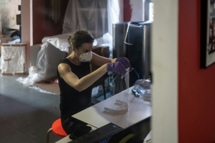 Luba Drozd makes protective shields for health workers in her apartment on her 3D printers, having raised money for supplies in a GoFundMe campaign