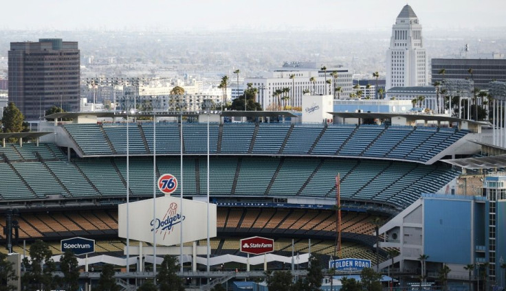 Dodger Stadium in Los Angeles remains empty with Major League Baseball shut down for the coronavirus, and most Americans in a new poll say they would be reluctant to attend future sports events until a vaccine is developed