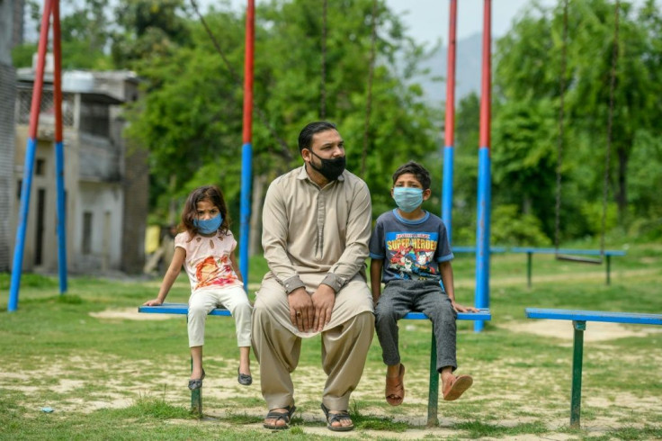 Aamir Gill (C), a cleaner and member of Pakistan's Christian underclass, was fired with no warning days after the coronavirus crisis took hold in Pakistan