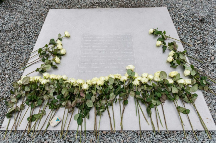 People have been asked to place flowers at the entrance of the camp