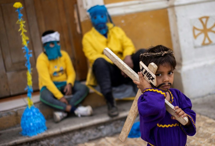 A boy dressed as Jesus takes part in the Good Friday procession in Masatepe