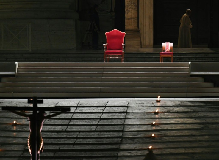 Francis cut a lonely, but striking figure figure when he slowly entered a starkly empty Vatican square for a torch-lit Good Friday procession