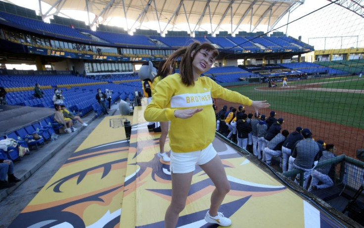 A cheerleader dances during the opening match of the Chinese Professional Baseball League at the Taichung International Baseball Stadium