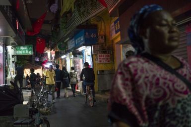 People walk in Guangzhou's "Little Africa" district in March 2018