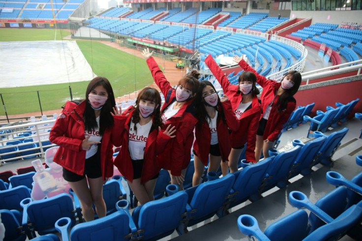 Cheerleaders from the Rakuten Monkeys pose at the Taoyuan Baseball stadium before the opening match