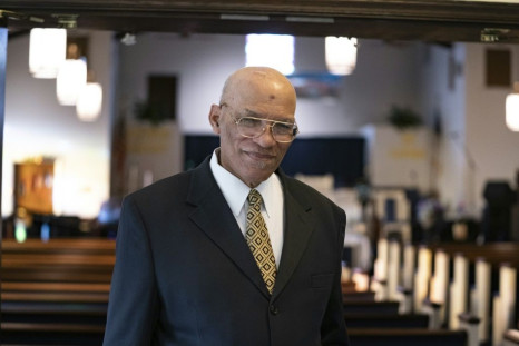 Pastor Alvin Gwynn, seen on April 12, 2020 in his church in Baltimore, Maryland, has defied a government order against large gatherings and urges the faithful to attend in person