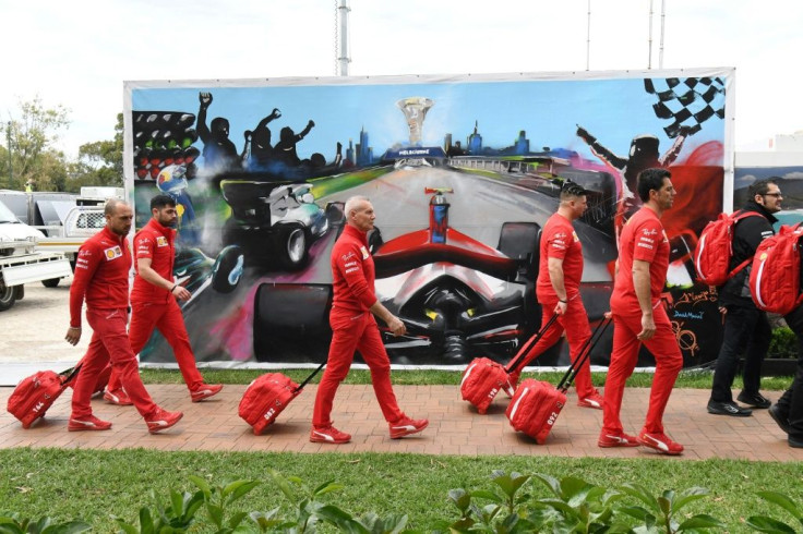 The Ferrari team prepares to leave the track after the cancellation of the Australian Grand Prix
