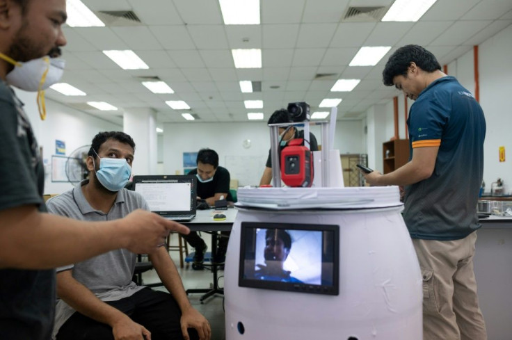 Malaysian scientists have created a barrel-shaped robot on wheels that they hope will make the rounds on hospital wards to check on coronavirus patients