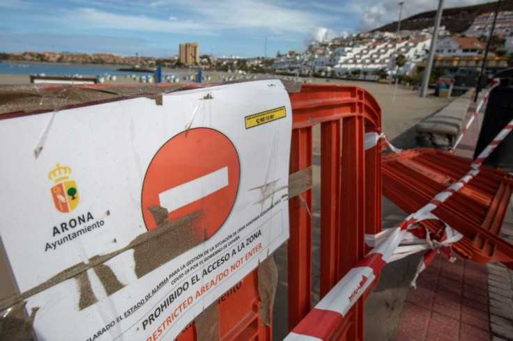 Despite the partial easing of coronavirus-linked restrictions, barriers still block an entrance to a beach in Arona, usually a major draw for tourists in Tenerife on the Canary Islands