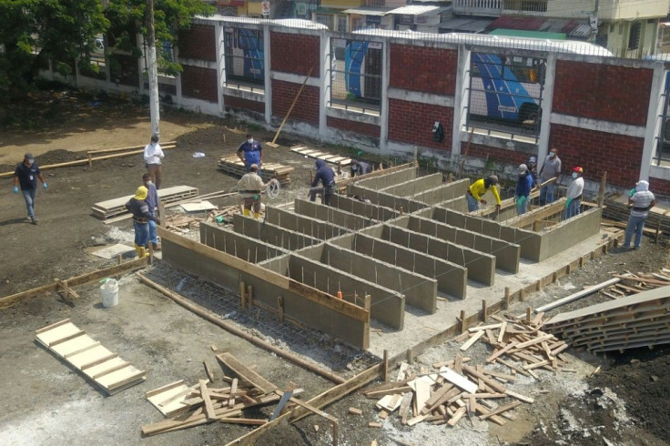 Workers build new graves in a cemetery in Guayaquil, Ecuador, on April 12 2020