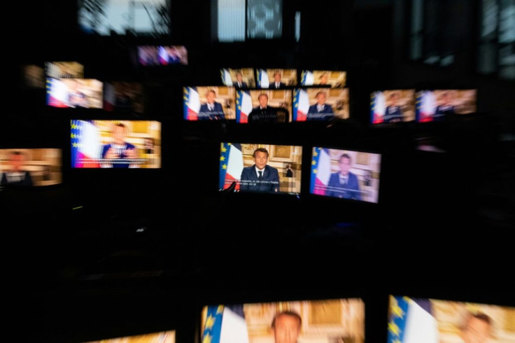Macron, seen on multiple monitors in Paris during a speech to the nation from the Elysee Palace, said restrictions could start to be eased after May 11, 2020 if positive trends continued