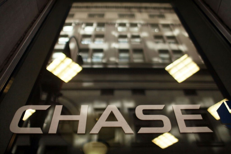 JPMorgan Chase reported a huge decline in first-quarter earnings after setting aside nearly $8.3 billion for loans vulnerable to the economic devastation from coronavirus shutdowns