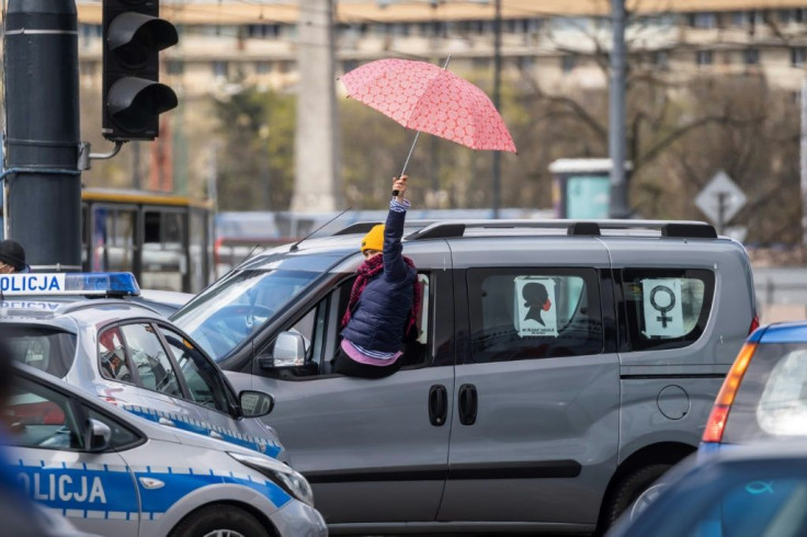 Police in Warsaw warned protesters they risked legal repercussions, including fines, for staging the protest