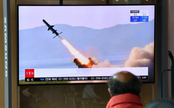 A man in a Seoul railway station watches a television broadcast on April 14, 2020, showing file footage of a North Korean missile test, after Pyongyang launched several suspected short-range cruise missiles toward the sea