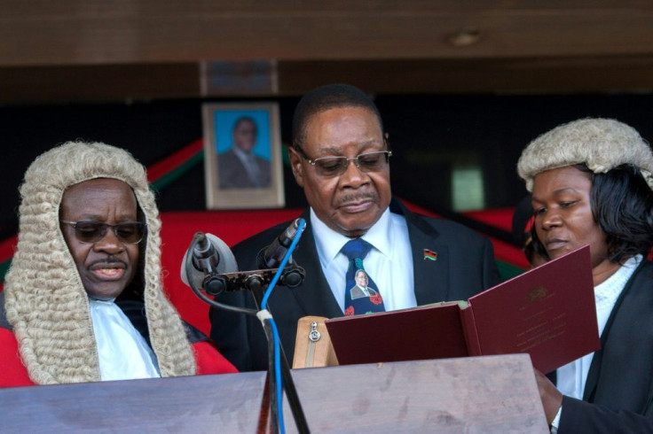 President Peter Mutharika (shown being sworn in May 28, 2019 by Chief Justice Andrew Nyirenda, L) is appealing after the Constitutional Court annulled the election and ordered a re-run, citing 'grave' and 'widespread' irregularities