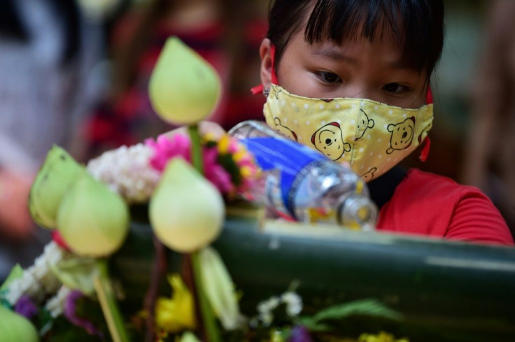 Buddhists believe pouring water over an abbot's hands will wash away past misdeeds