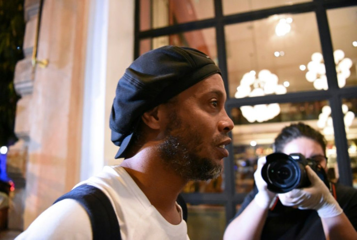 Brazilian former soccer star Ronaldinho arrives at a hotel in downtown Asuncion on April 7 to begin his house arrest after his release from jail
