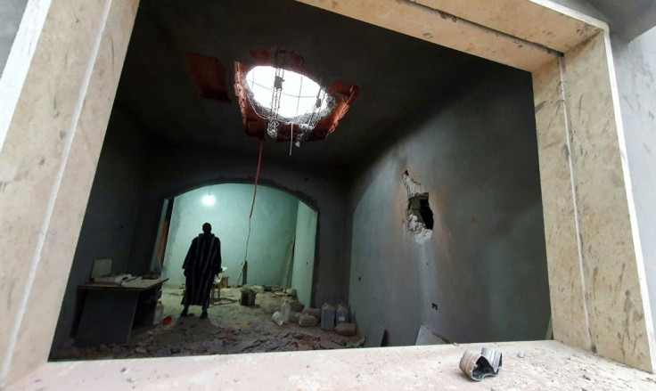 A Libyan man stands at the site of shelling on the residential area of Arada in the capital Tripoli on April 14, 2020