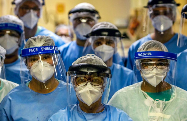 A group of doctors working with patients infected with the novel coronavirus COVID-19 wear face shields at the Intensive Care Unit of the Hospital de Clinicas in Porto Alegre, Brazil