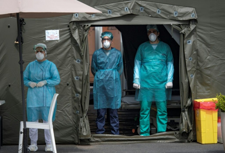 Members of the medical staff at the Mohammmed V military hospital, wear a protective masks and caps as they wait for patients, in the Moroccan capital Rabat